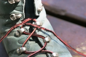 Boot laces frayed at the fourth eyelet up from toe.