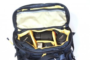 The interior compartment fits a digital SLR camera body, two or three lenses and a flash. 