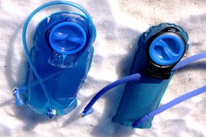 Three-liter Antidote reservoir on left compared to two-liter standard reservoir on right.