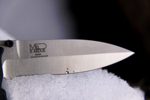 Blade material is 154CM stainless steel in a modified spearpoint blade design.